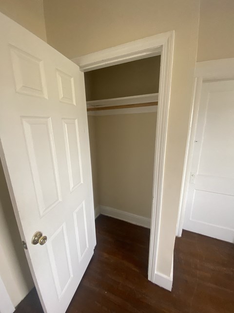 the closet in the master bedroom is open to the hallway with a door to the