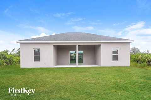 A house with a grey roof and a white exterior is shown with the words "FirstKey Homes" on the bottom left.
