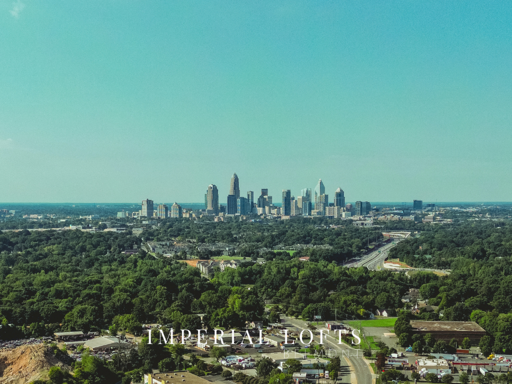 an aerial view of the city with the skyline in the background