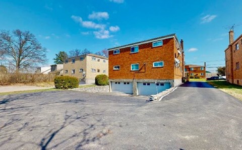 a large brick building on the side of a street
