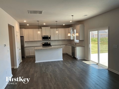 a kitchen with white cabinets and a white counter top
