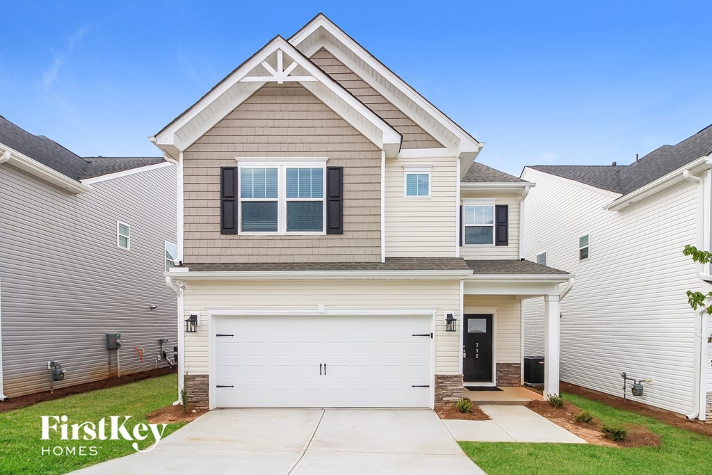 A house with a garage is for sale by FirstKey Homes.