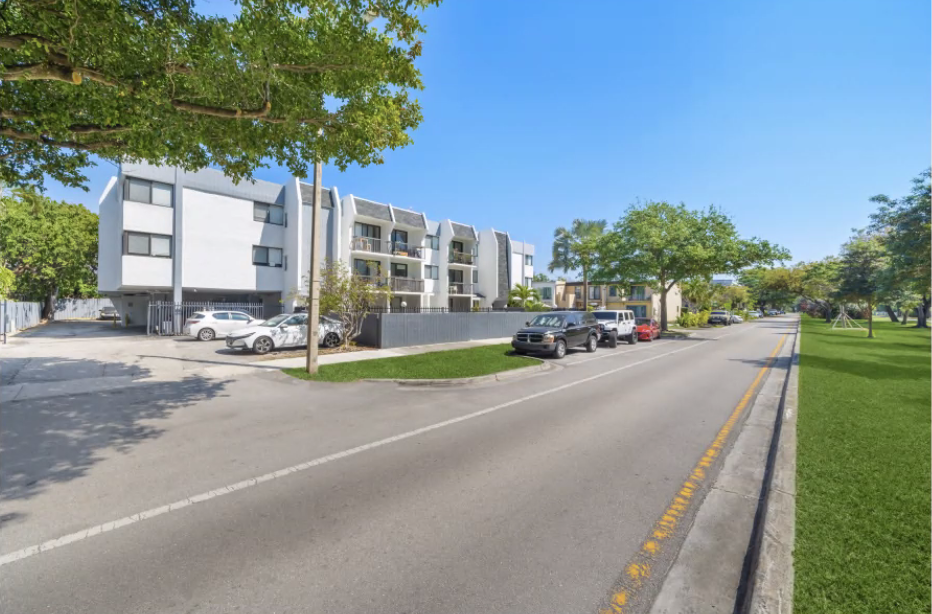 an empty street with buildings on the side of it