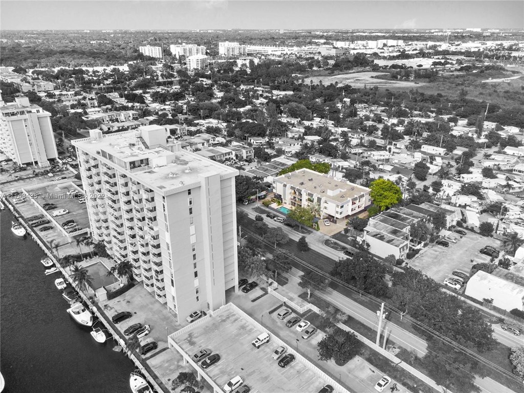 a black and white photo of a city with tall buildings
