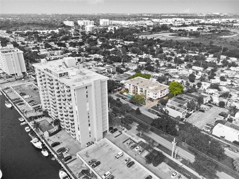 a black and white photo of a city with tall buildings
