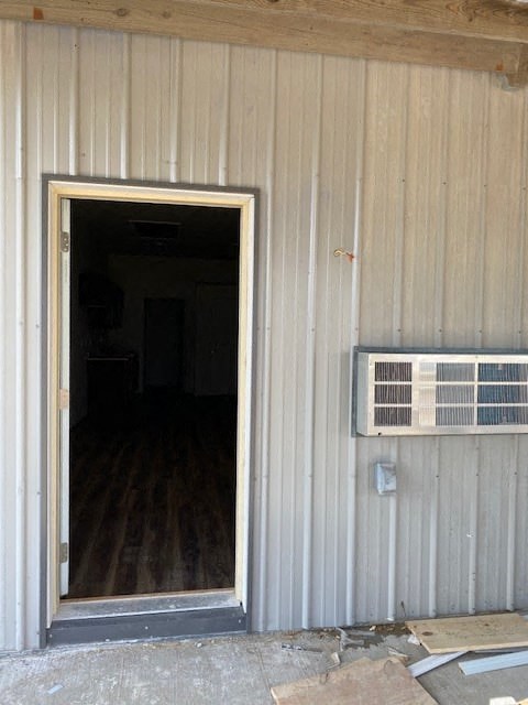 an open door of a building with an air conditioning unit