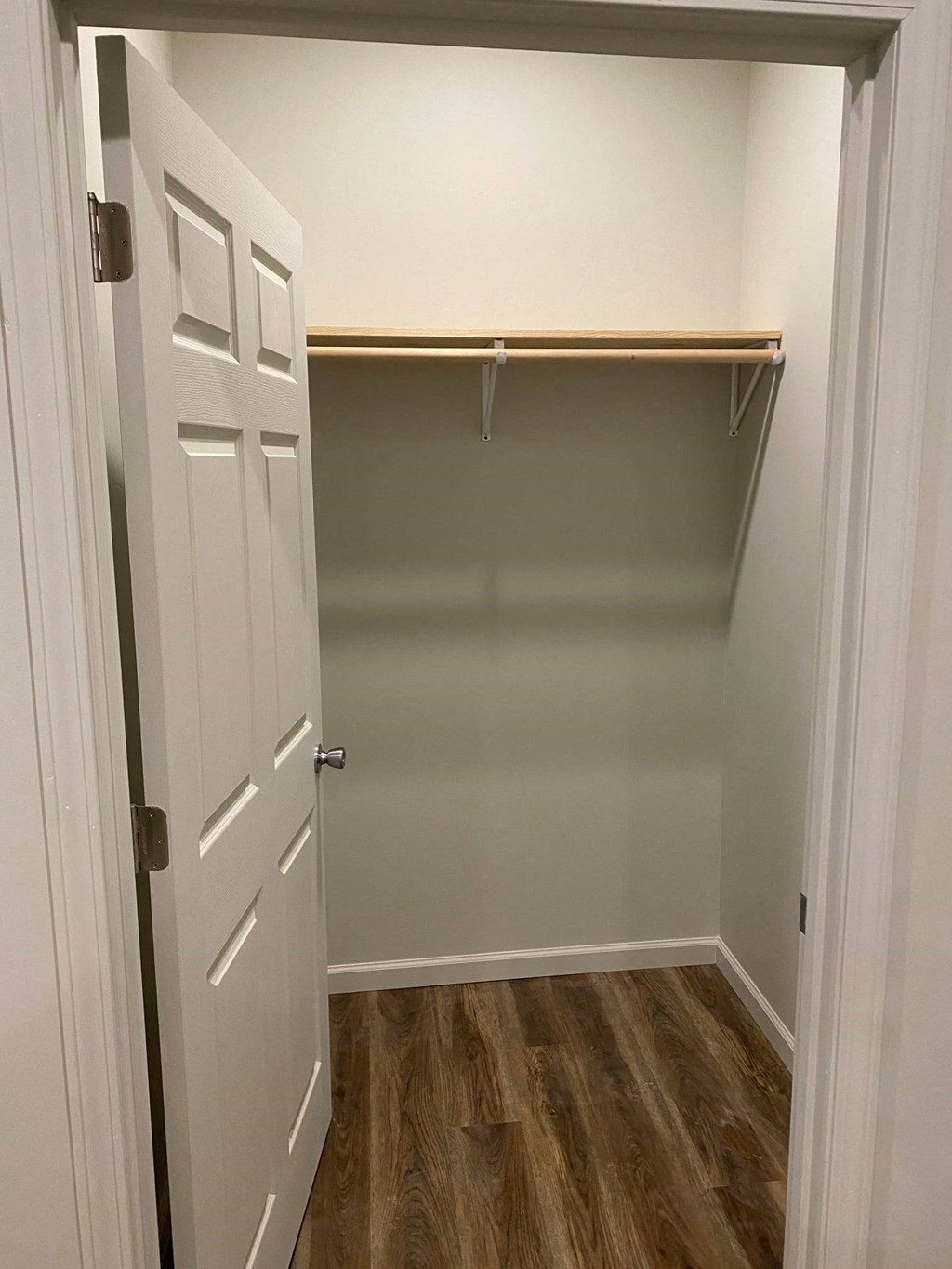 a room with a closet and a door