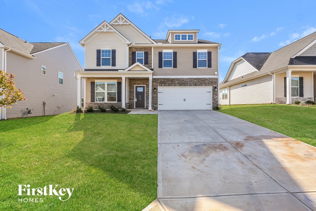 a large house with a driveway in front of it