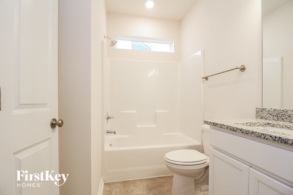 a small bathroom with a shower and a toilet