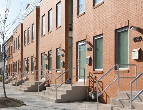 A red brick building with the number 416A on the front.