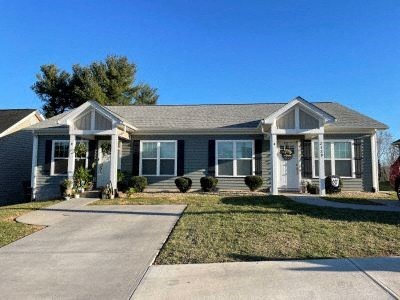 a house with a sidewalk in front of it