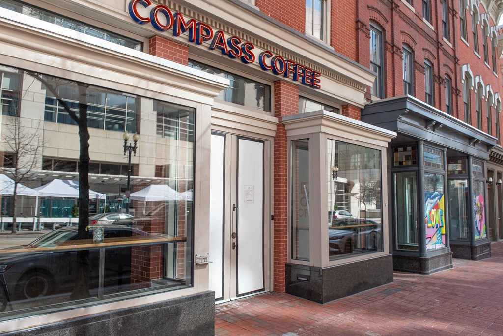 the facade of a coffee shop on a city street