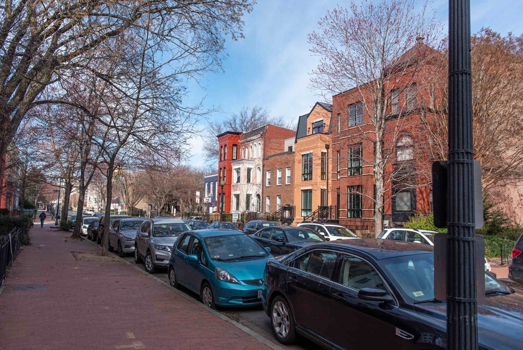 a row of cars parked on a street