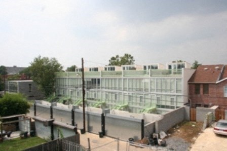 a large white building with a river in front of it