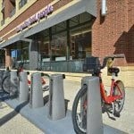 a bike parked in front of a building
