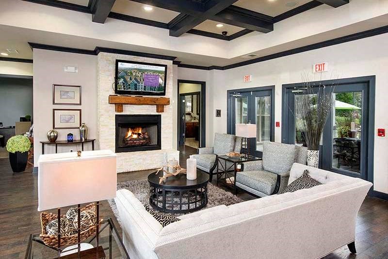 a living room with a couch and a fireplace