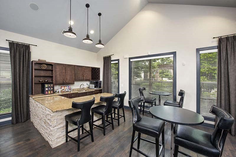 a kitchen and dining room with a table and chairs