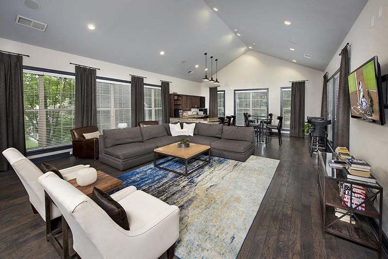 a large living room with couches and a table