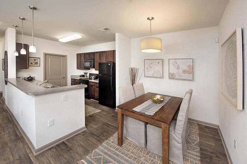 a kitchen and dining room with a table