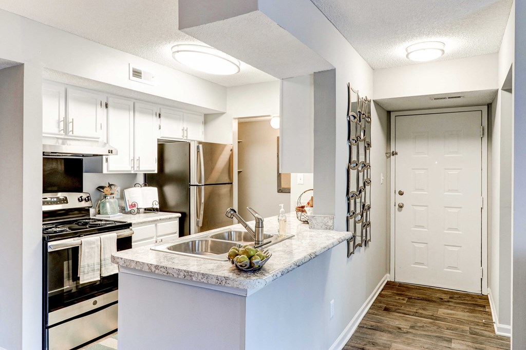 a kitchen with a large counter top and a sink