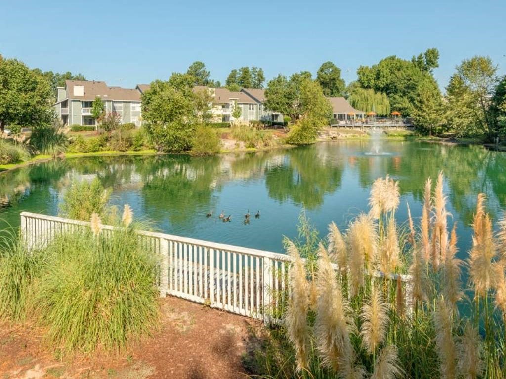 a view of a lake with houses in the background