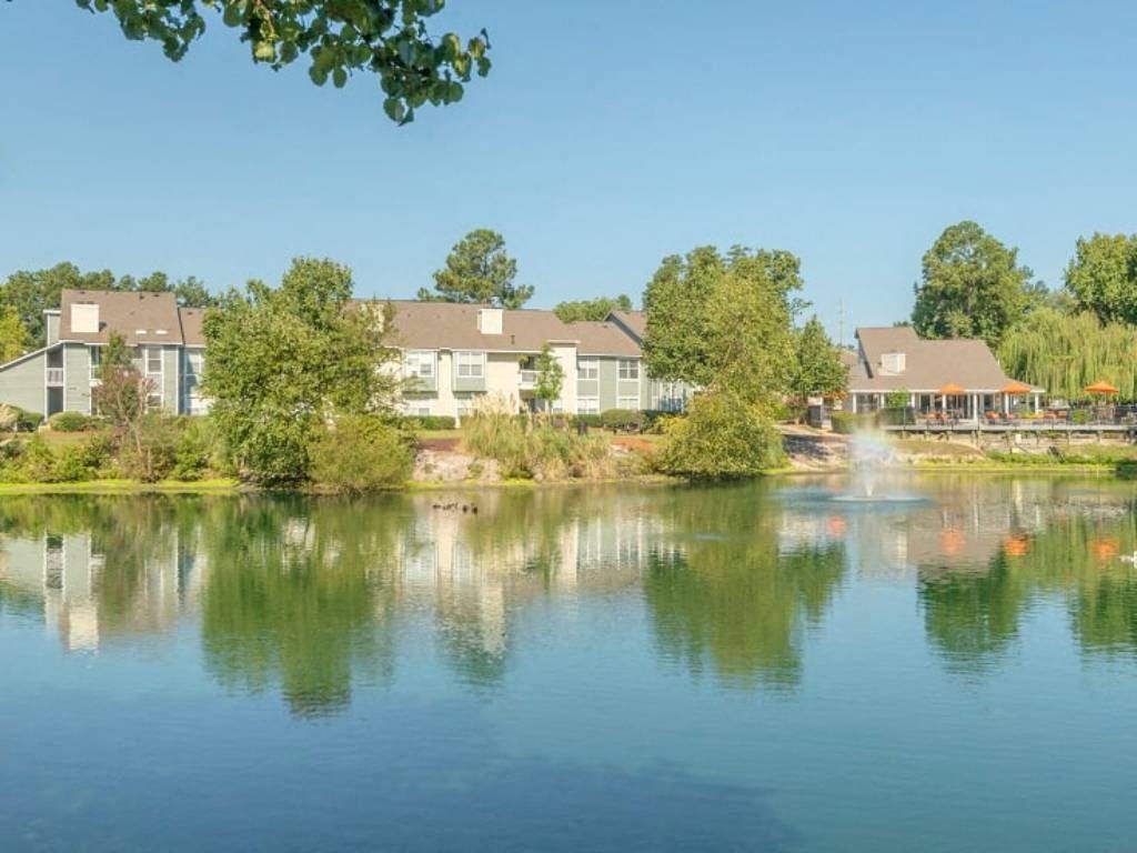 a view of a lake with houses in the background