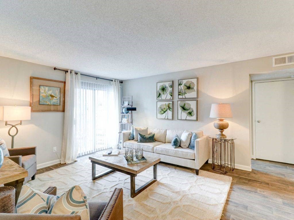 a living room with a couch and a table