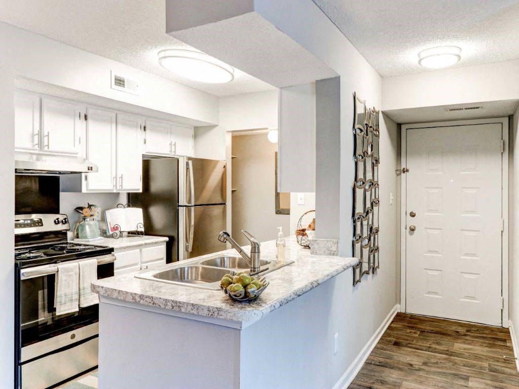 a kitchen with a counter top and a sink
