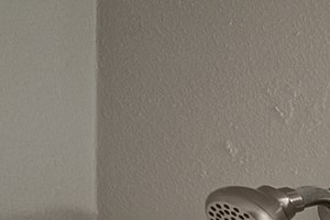 a bathroom with a toilet and a sink and a mirror