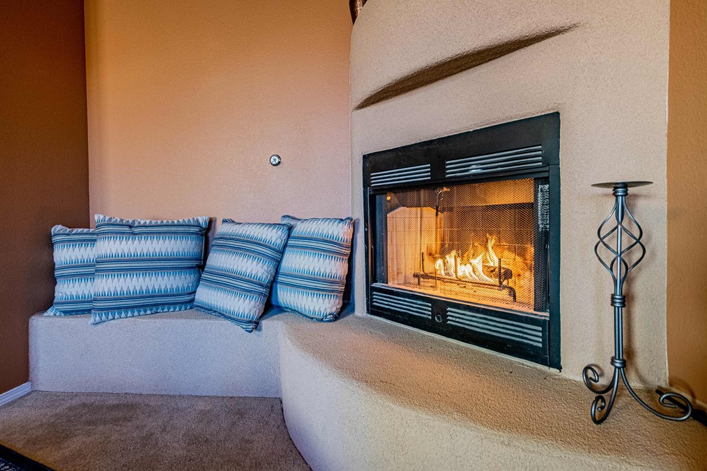 a living room with a fireplace and a couch