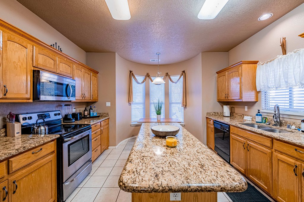 a kitchen with a granite counter top