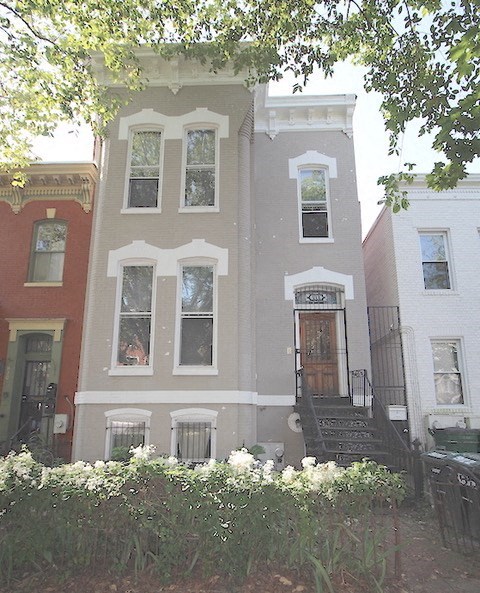 a building with a staircase and a front door