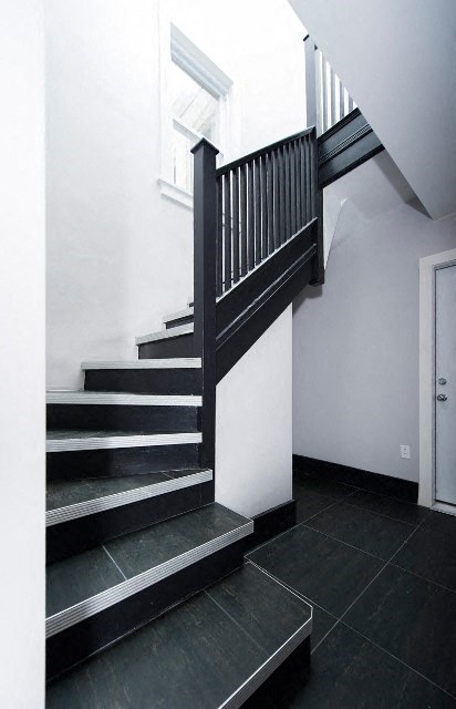 a black and white staircase in a house