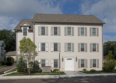 A large house with a white door and windows.