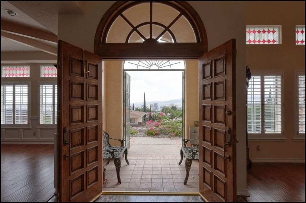 a view through an open door into a living room