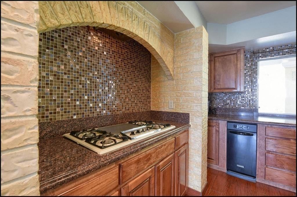 a kitchen with a stove and a counter top