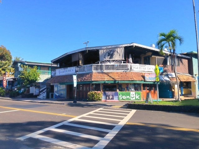 an old building on the corner of a street