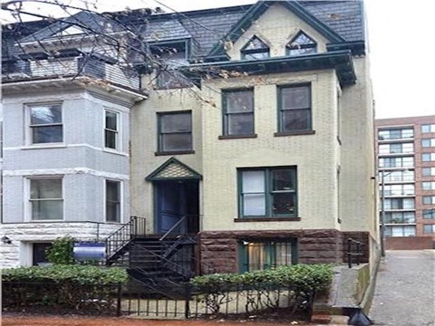 a white house with a fire escape