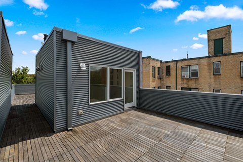 the deck off of the master bedroom has a view of the city