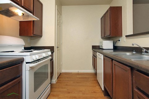 a kitchen with a stove and a sink