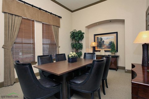 a dining room with a table and chairs