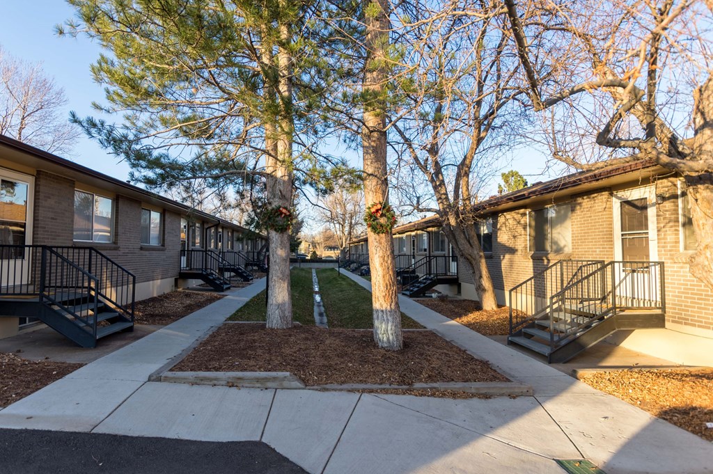 our apartments have a sidewalk and trees in front of them