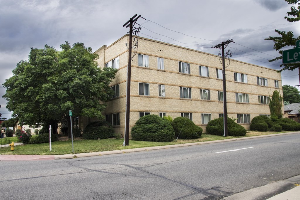 an old building on the corner of a street