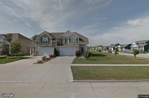 A row of houses with a clear sky above them.