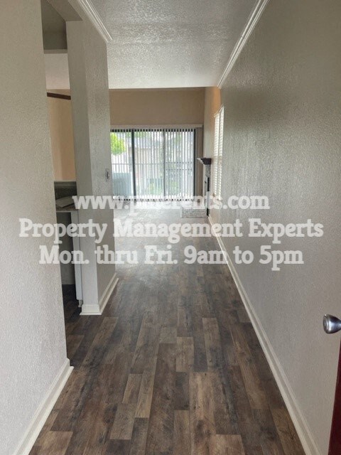 a view down the hallway of an empty house
