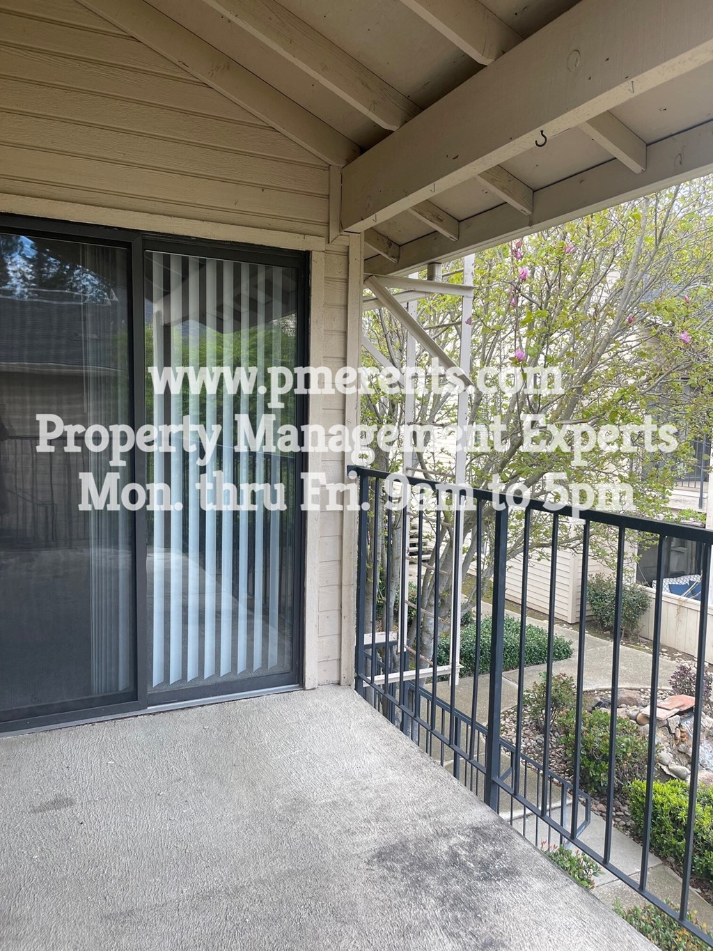 a view of the front door of a building with a gate