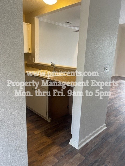 a view of a kitchen and a living room