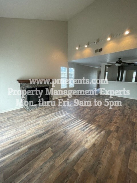 a living room with a hard wood floor