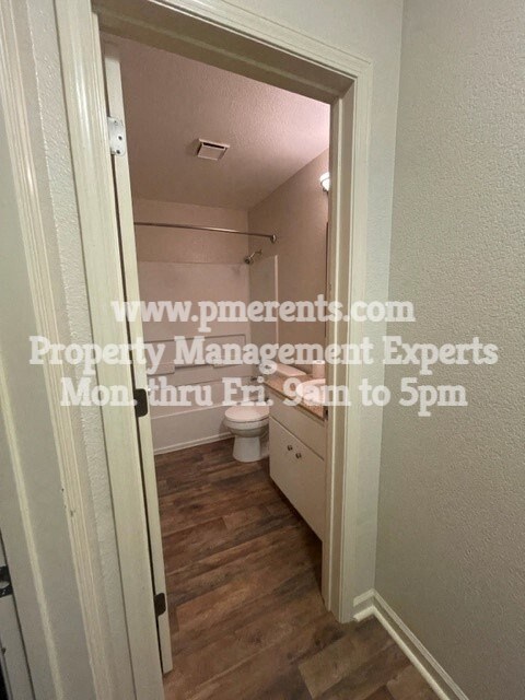 a small bathroom with a toilet and a door