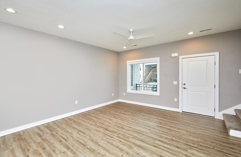 A room with a window and a door.